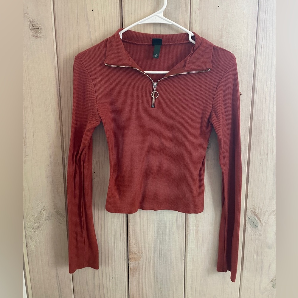 Burnt orange long sleeve blouse.